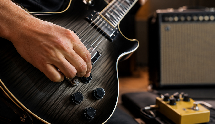 Por que grandes guitarristas não deixam o volume da guitarra sempre no 10